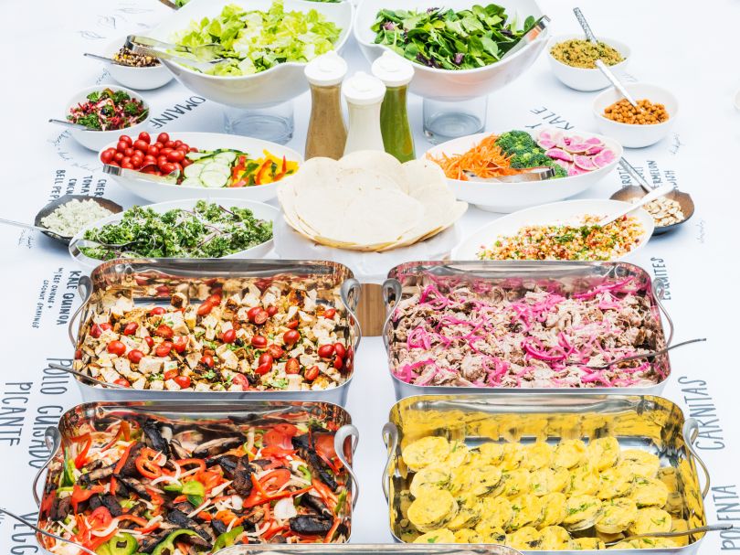 A table of food laid out on a table during a Sifted-catered meal